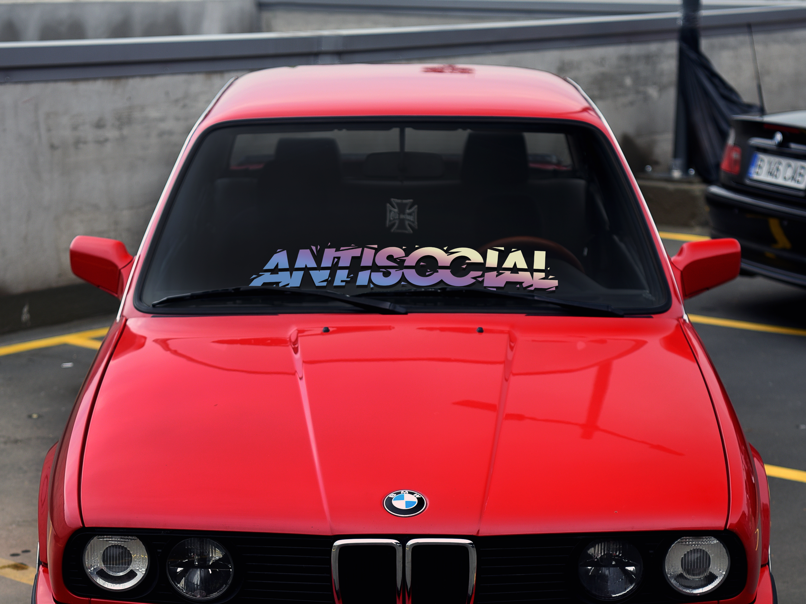 Antisocial windshield banner for cars and trucks. Aggressive style lettering with broken font falling apart in peices.