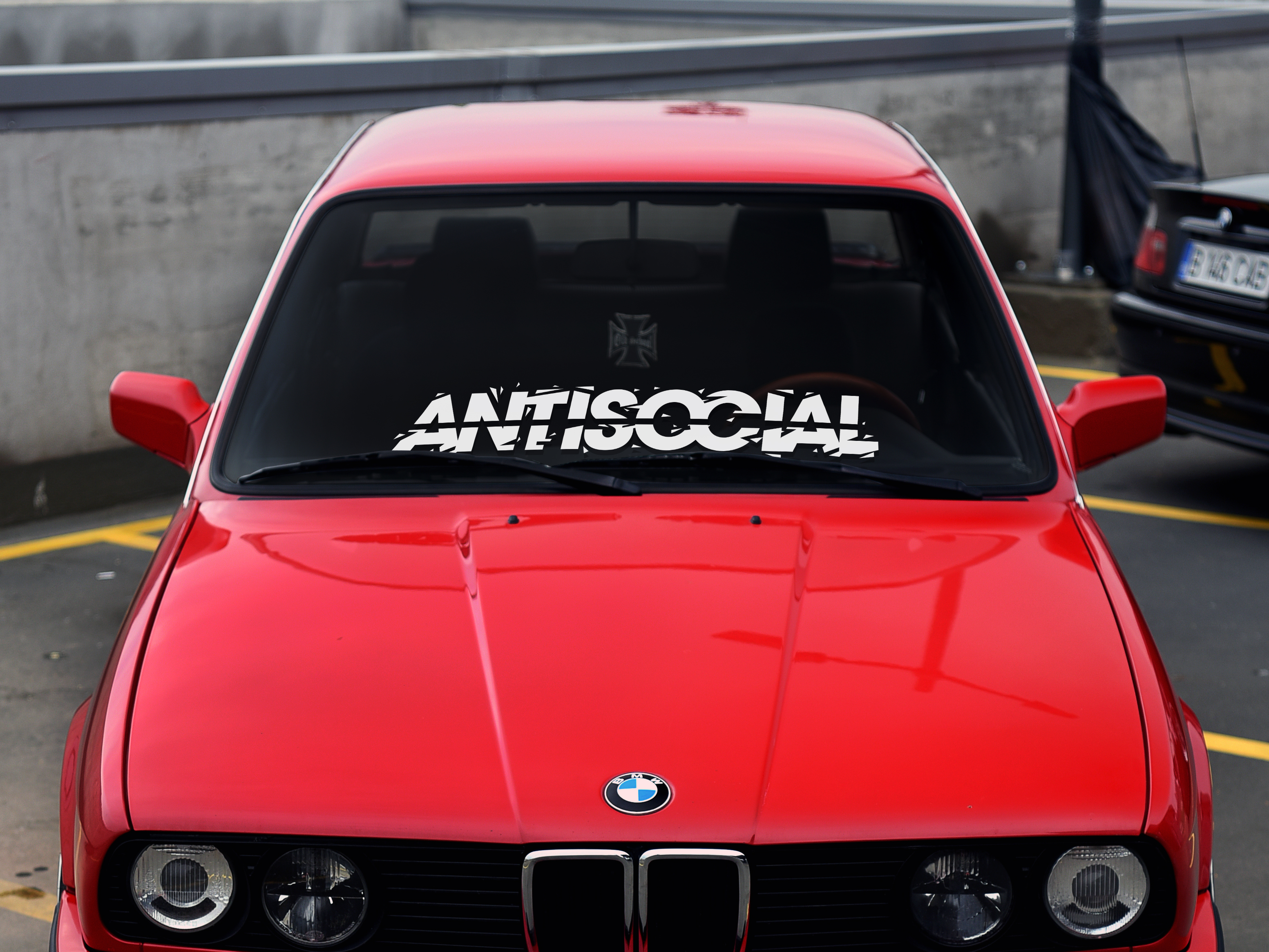 Antisocial windshield banner for cars and trucks. Aggressive style lettering with broken font falling apart in peices.