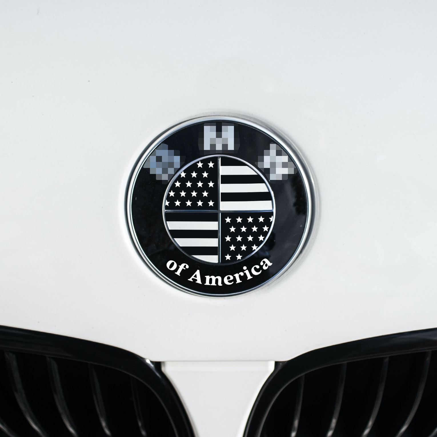 Overlay sticker that adds american flag over your BMW roundel emblem. Sticker features BMW of America lettering on the bottom. We only sell the sticker not the emblem.