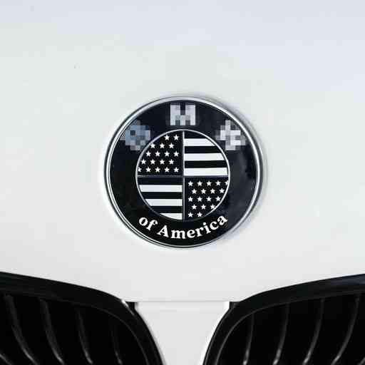 Overlay sticker that adds american flag over your BMW roundel emblem. Sticker features BMW of America lettering on the bottom.
