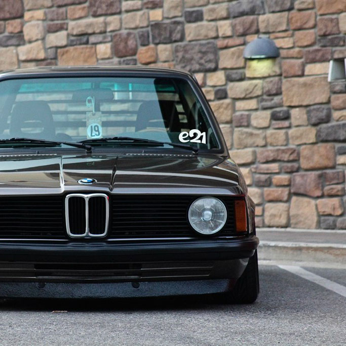 Lowered e21 BMW with vinyl sticker